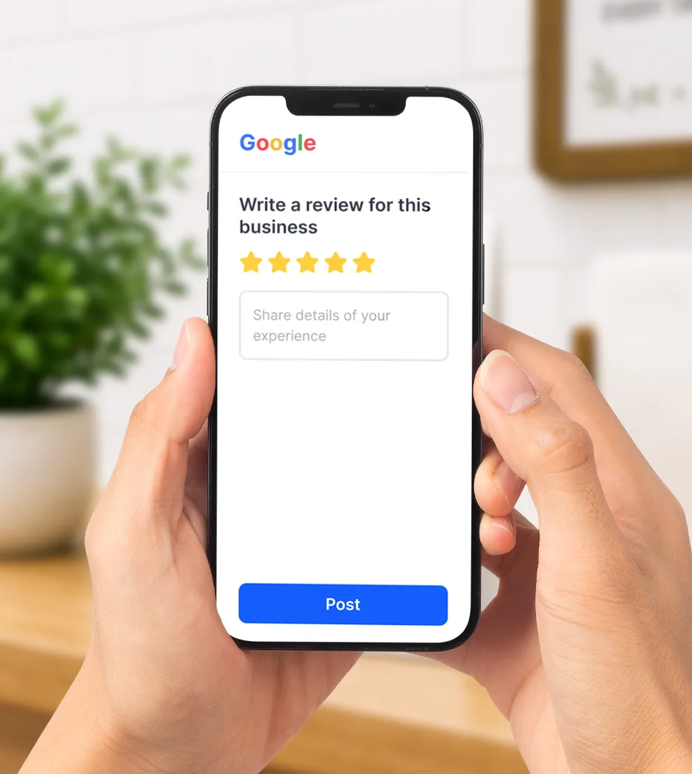 Smartphone showing Google's 'Write a review for this business' screen with a five-star rating selected and a Post button