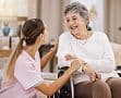 Caregiver supporting a senior resident